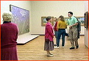 People in an art gallery looking at the artwork