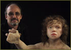 Mark Davis with sculpted Neanderthal boy