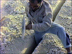 Man cutting stone