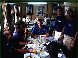 Eliu Sequeira and Alvaro Delgado S. stand before some happy diners.