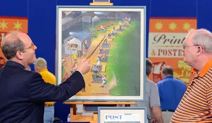 Alan Fausel points to detail on John Falter's "Golf Driving Range" painting.