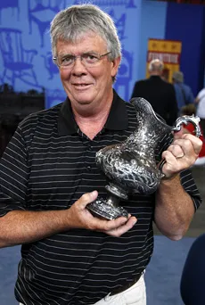 The guest holding his family heirloom, the Tiffany presentation pitcher.