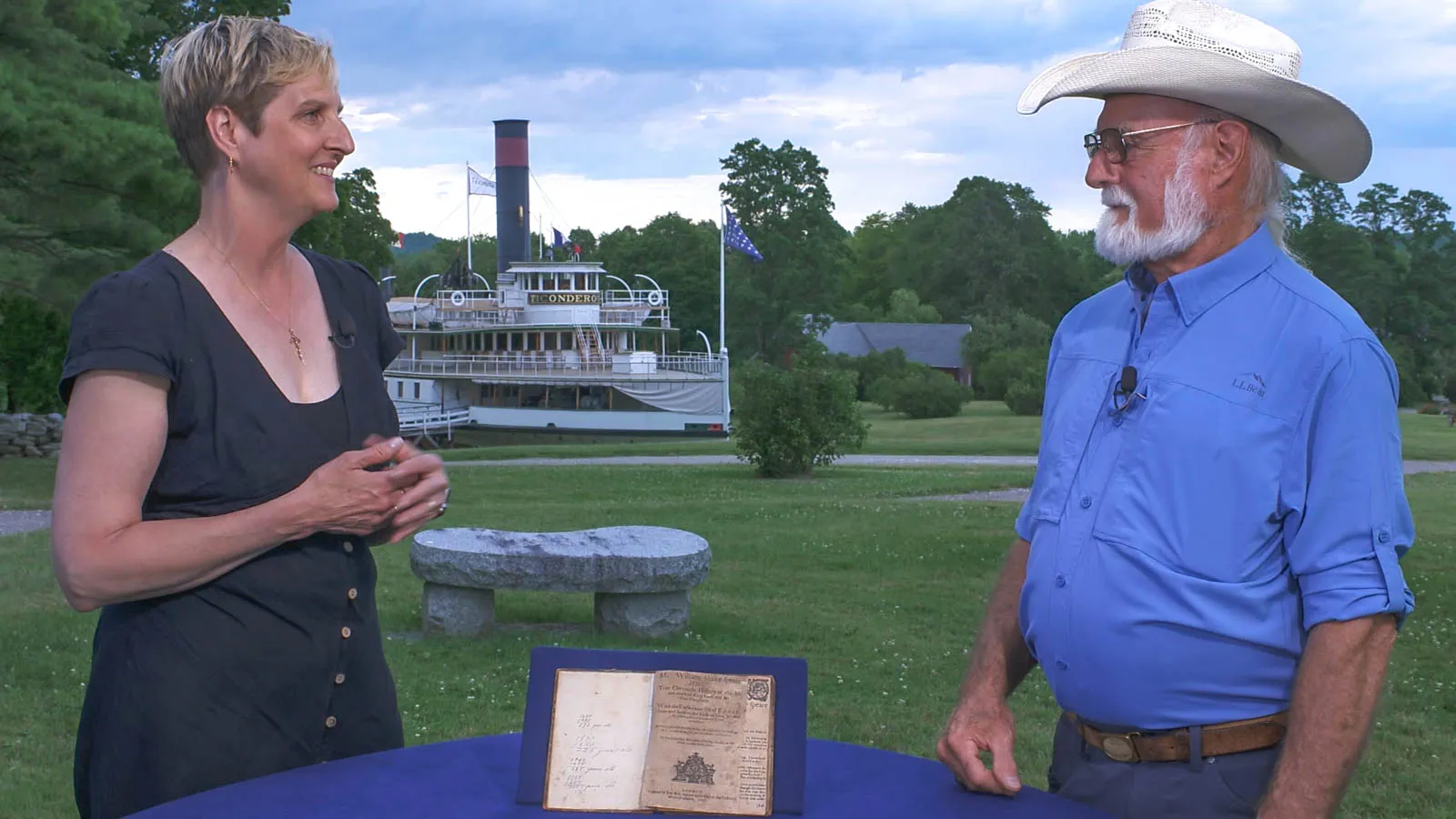 Books Appraiser Devon Eastland (left) and owner/guest Mike (right) discuss Mike's copy of Shakespeare's King Lear