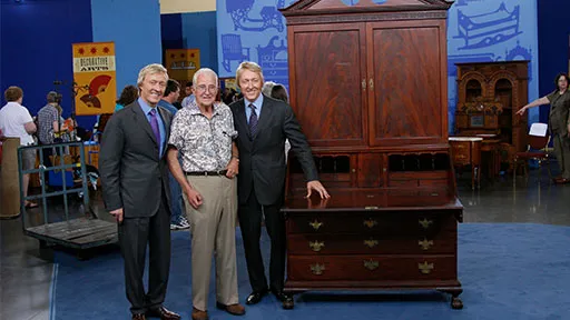 Leigh and Leslie Keno pose with the Samuel Prince secretary and its owner Clarence