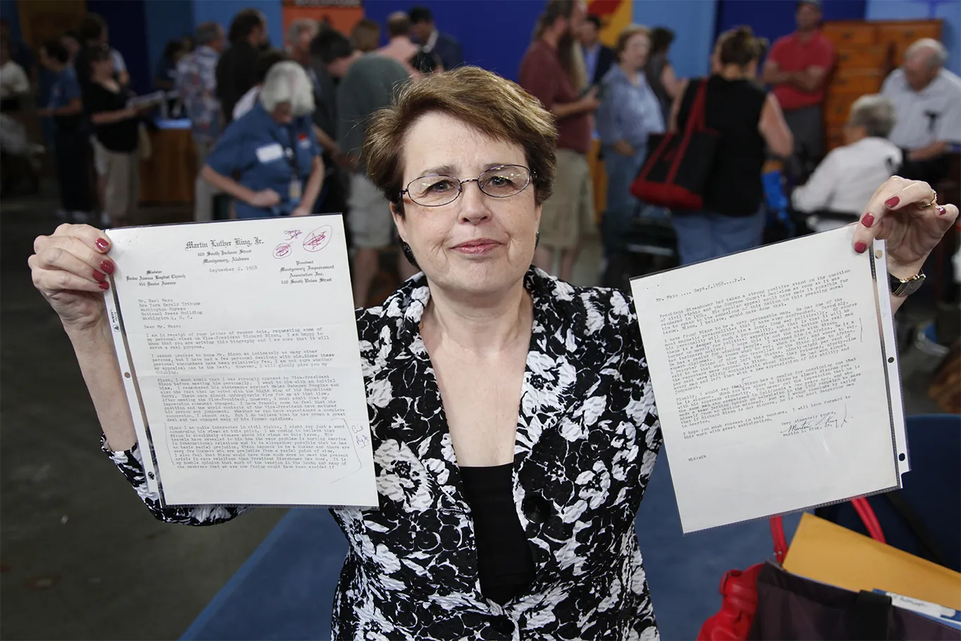 Woman holding her letter.