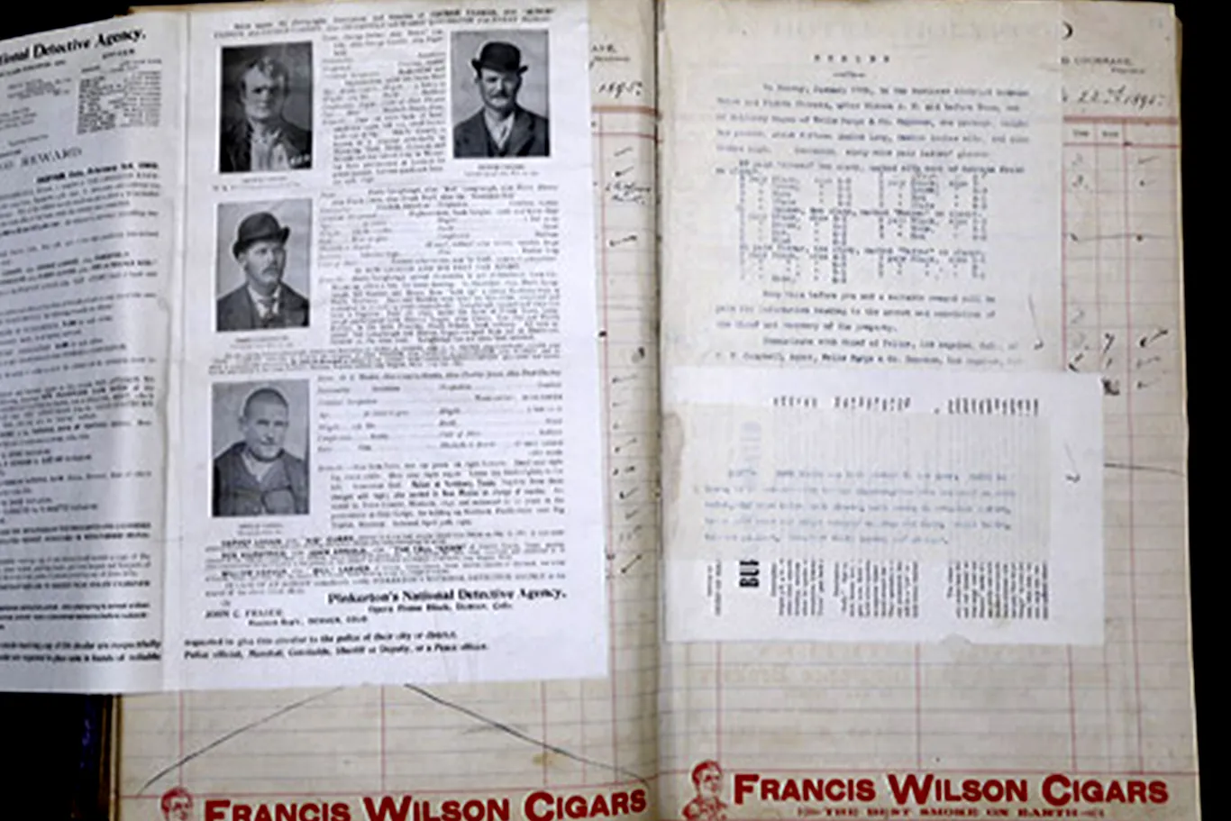 A page in the ledgers with wanted photos of Butch Cassidy, the Sundance Kid, and more.